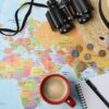 Flat,Lay,Composition,With,Different,Travel,Accessories,On,World,Map.