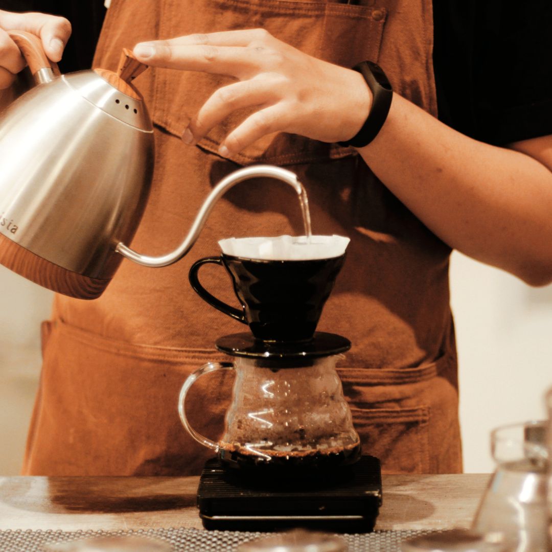 Someone making drip coffee