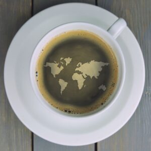 A coffee cup with the world in the cream