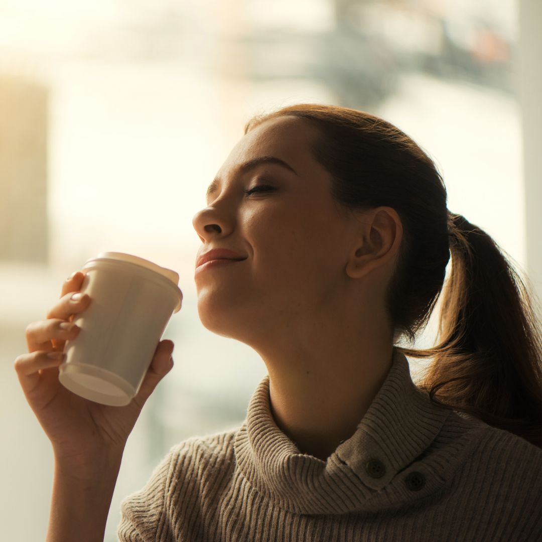 A woman sipping on coffee